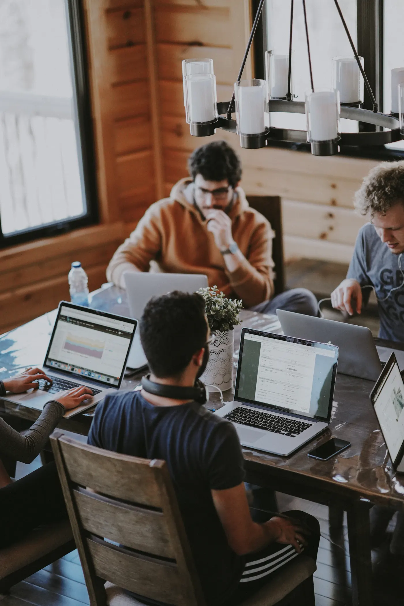 Creative team collaborating around a table in a modern studio
